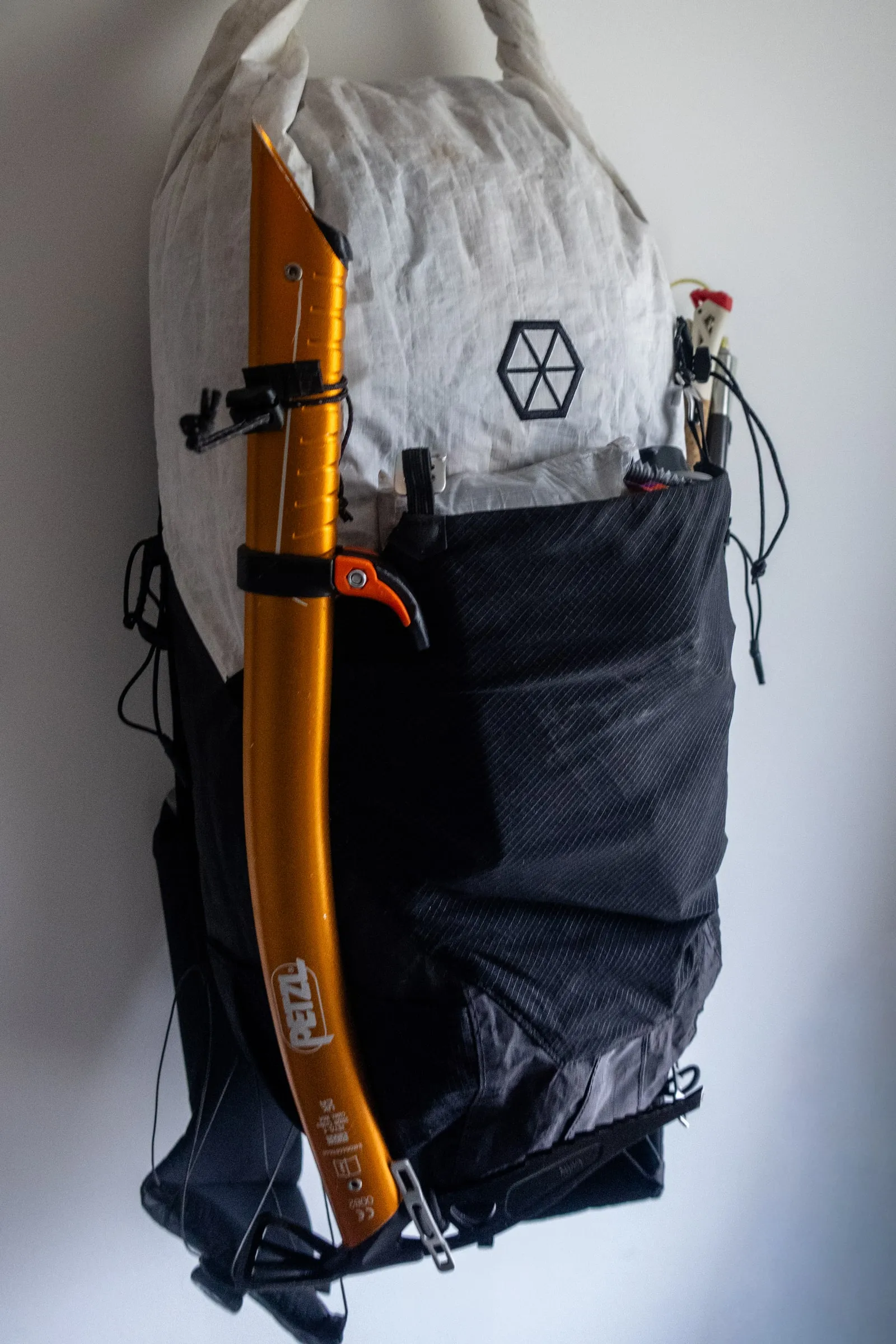 Petzl Gully ice axe secured head-down along the side of the Samaya Ultra Pace
