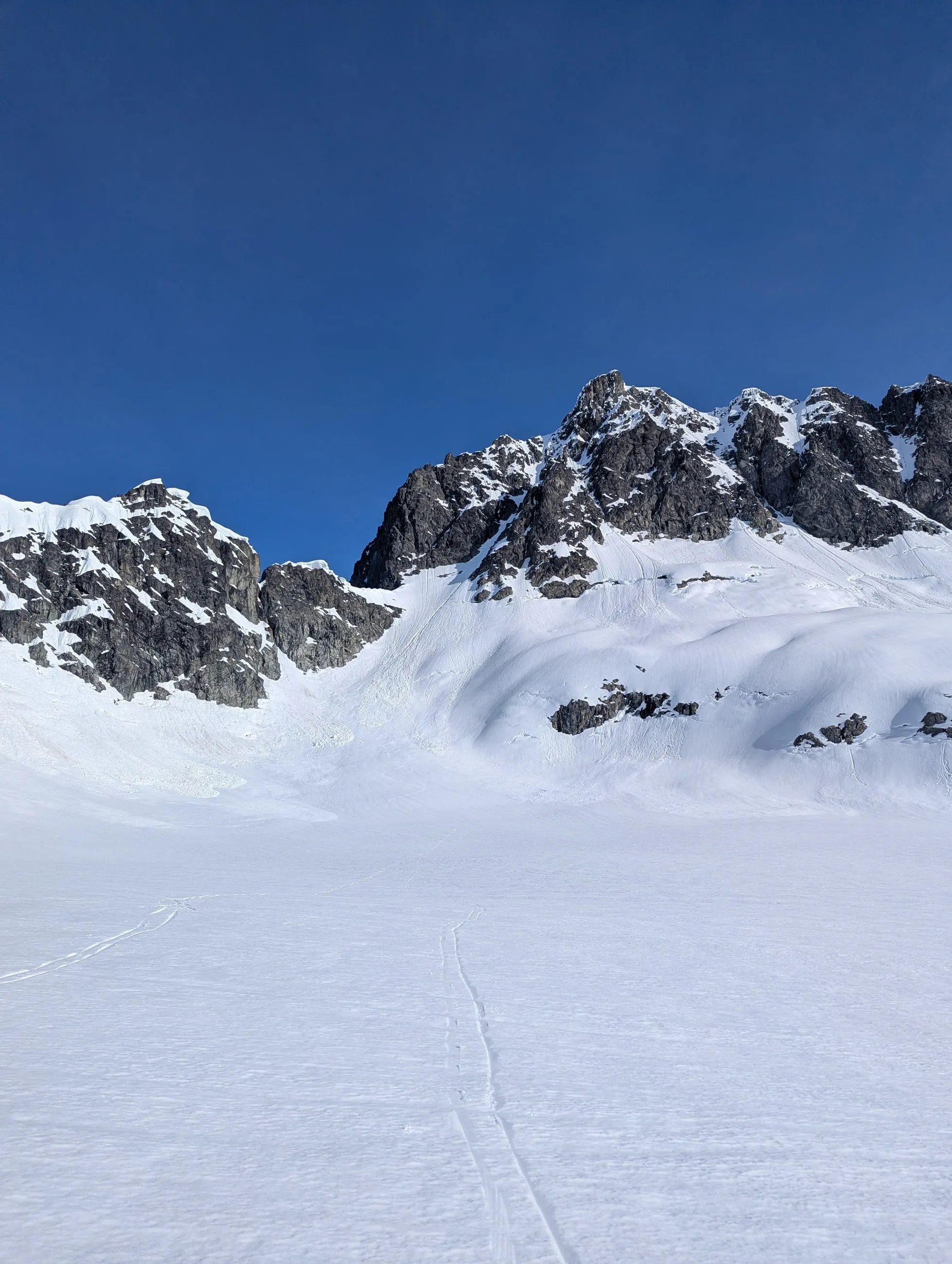 Looking back at the steep, avalanche-worn descent into the Lake Lovely Water basin