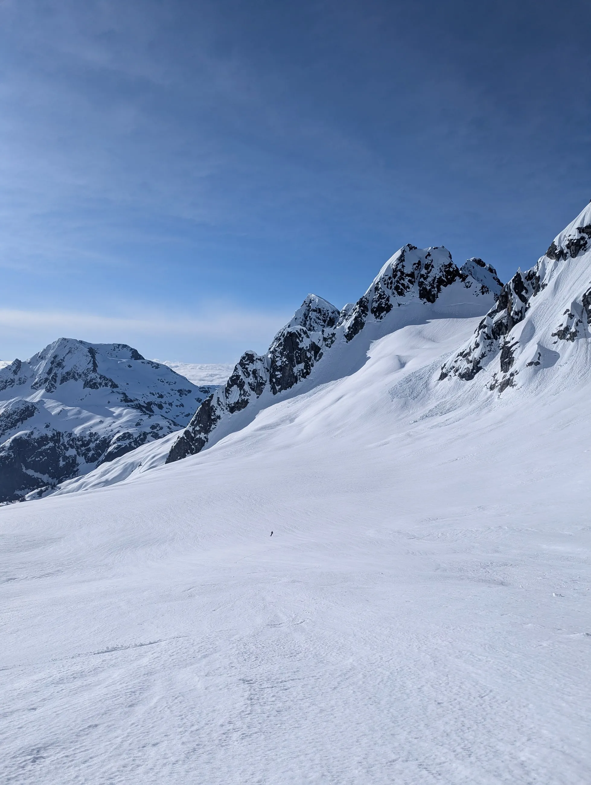 Alexis skiing below Jordan toward the bench beneath the slopes of Ionia