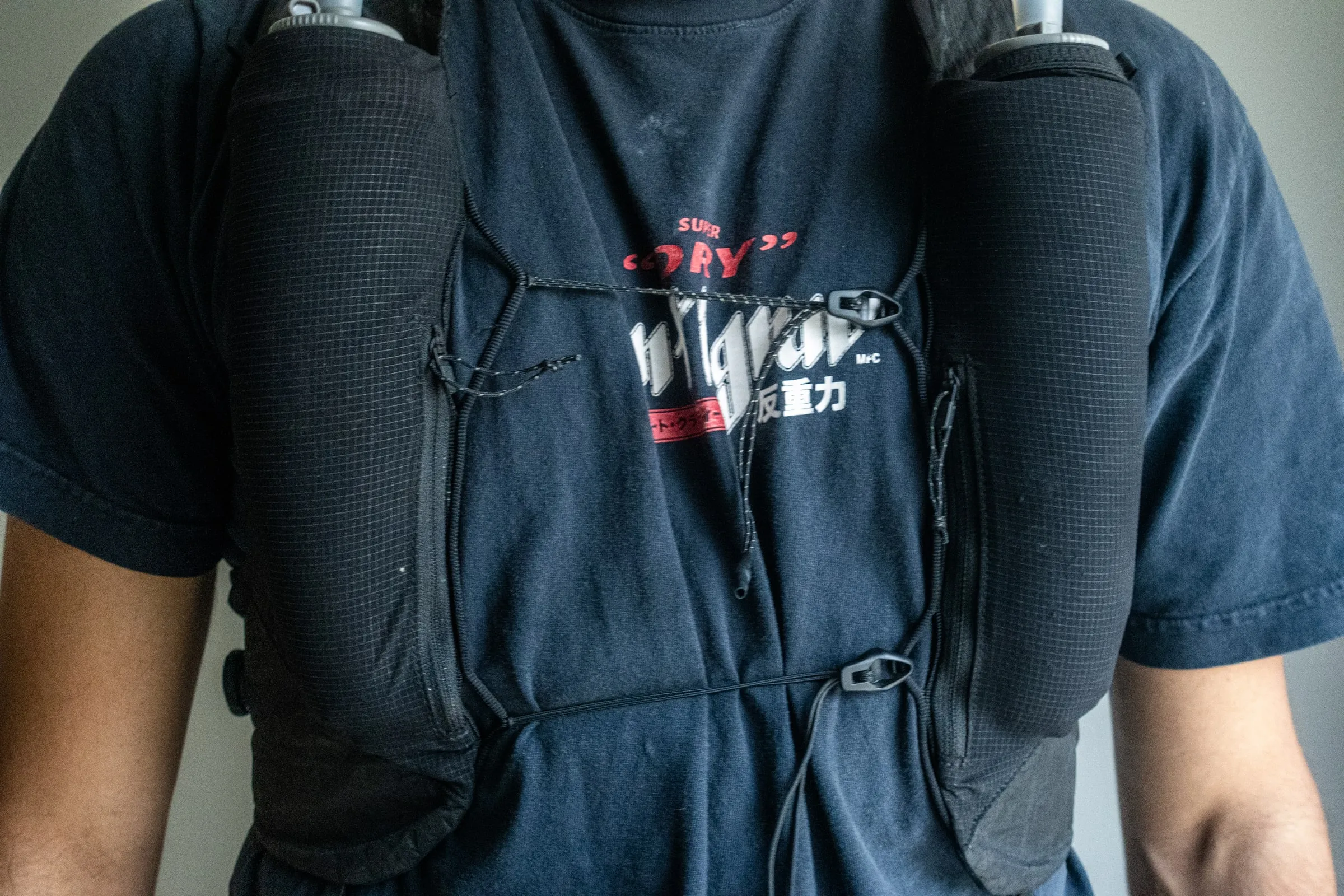 Front view of Jordan wearing the Ultra Pace with a 600 millilitre soft flask on the left and a 500 millilitre flask on the right