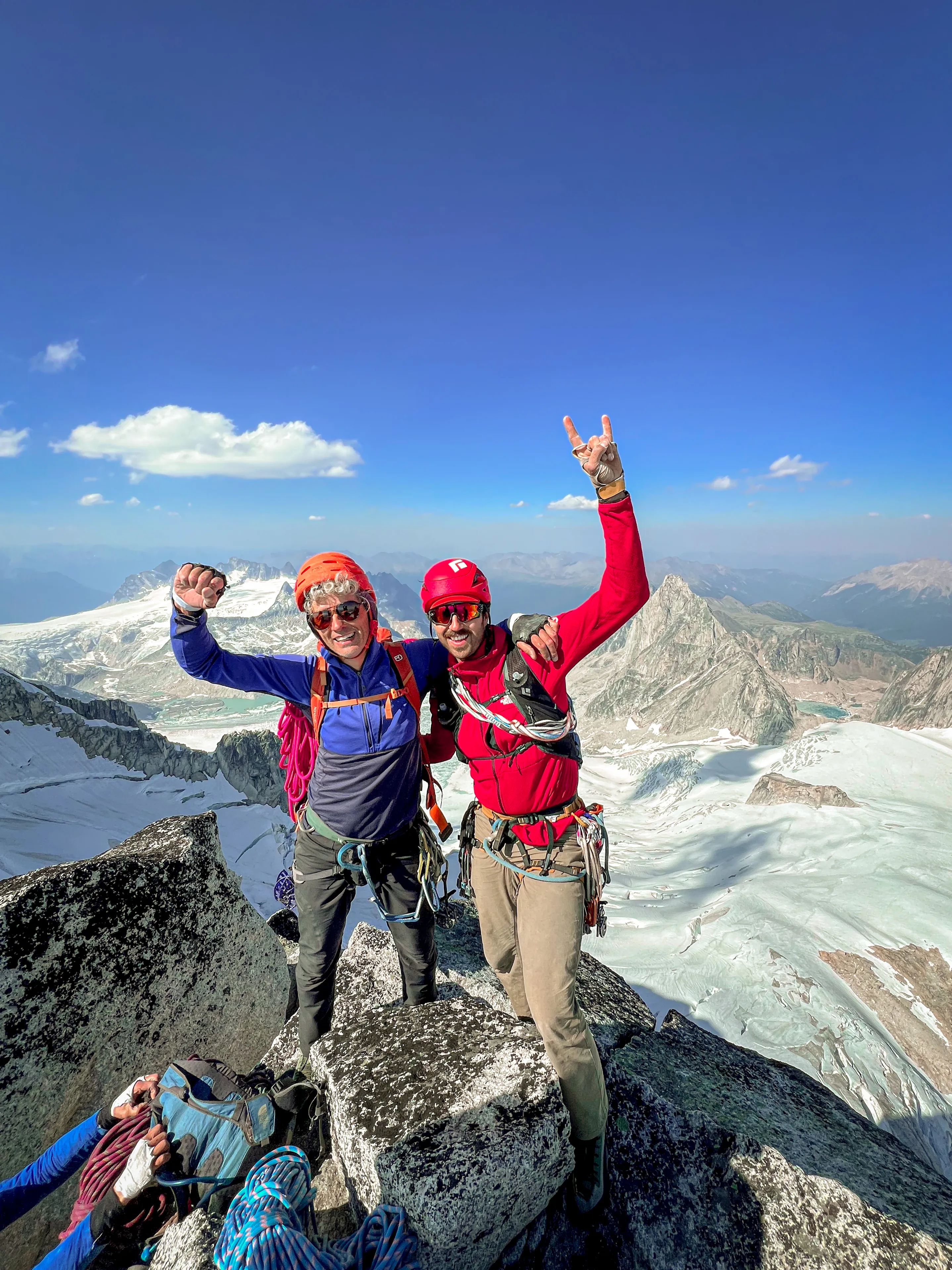 Jordan and Chris smiling together on the summit of South Howser Tower